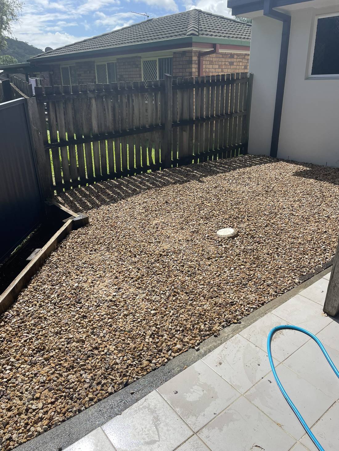 Backyard pebble groundcover
