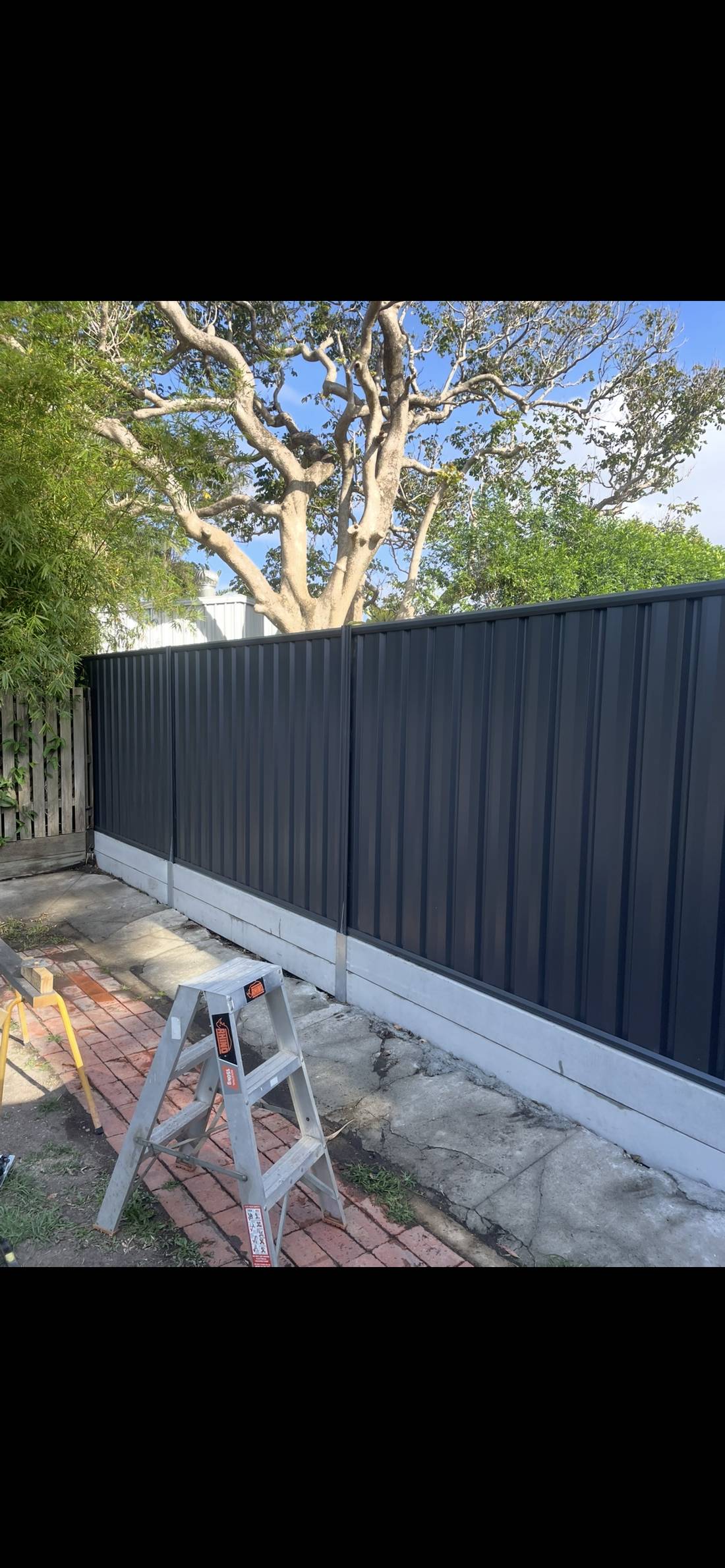 Colorbond fence & concrete sleeper retaining