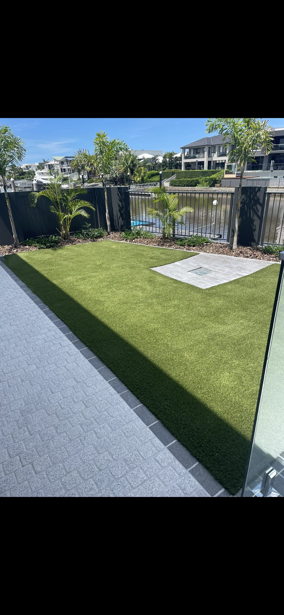 Premium synthetic turf install, canalfront.